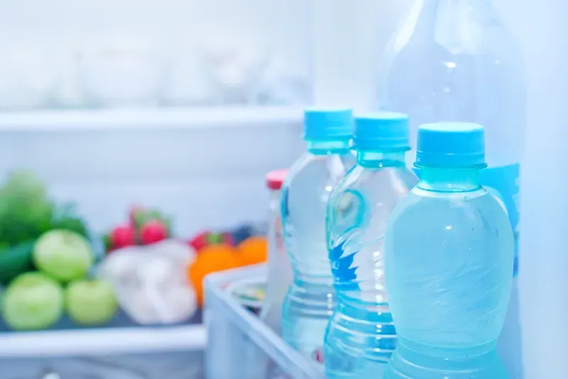 Refrigerator full of food, water in bottles